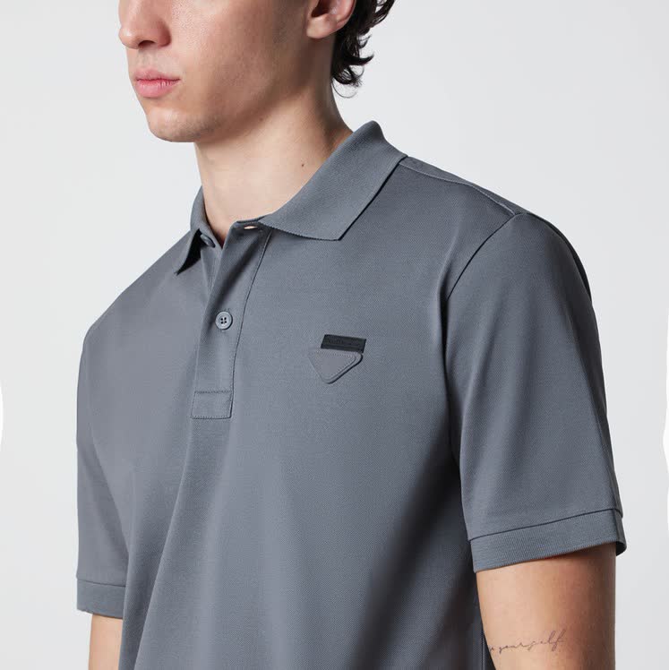 Prada Cotton Piqué Polo Shirt in classic white with logo detail
